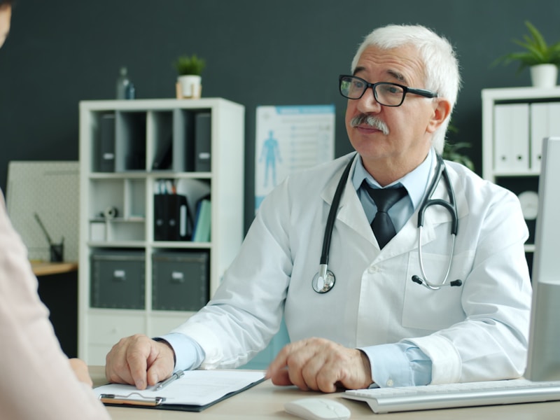 Male licensed psychologist consulting with a patient